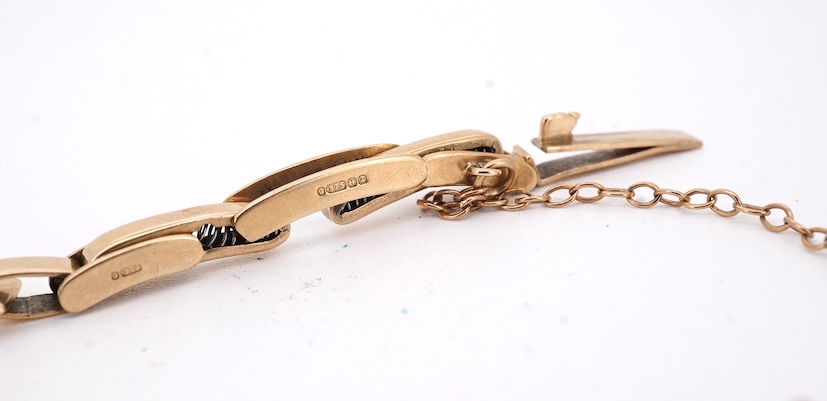 A lady's 9ct gold Record manual wind wrist watch, with Arabic dial and subsidiary seconds, on a 9ct gold bracelet, gross weight 16 grams. Condition - fair